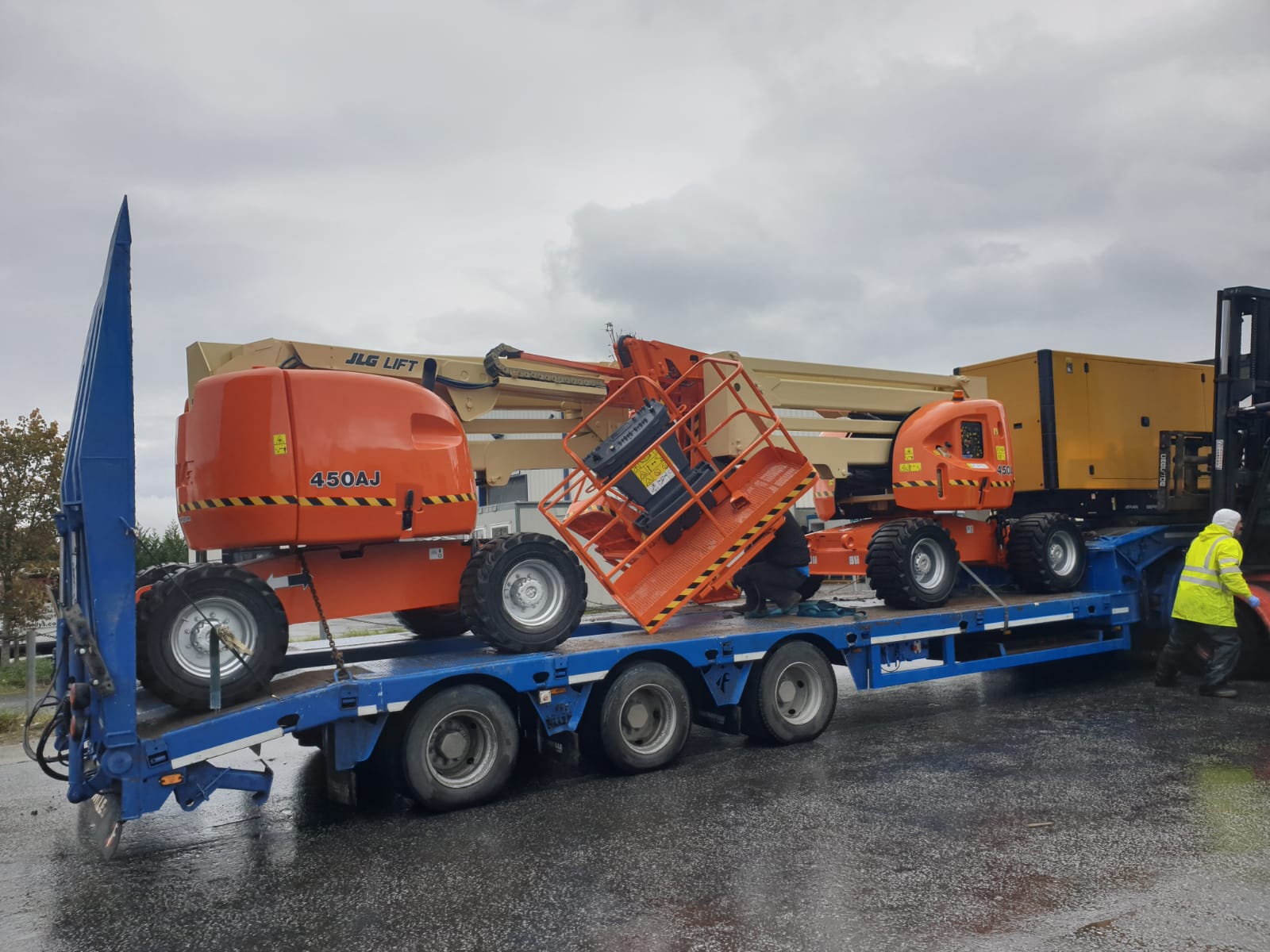 2 JLG booms and a CAT generator heading overseas